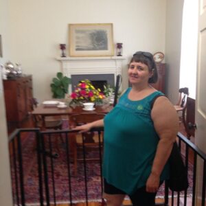 Photo: Sue M. standing at Dining Room entrance where young Helen threw many tantrums.